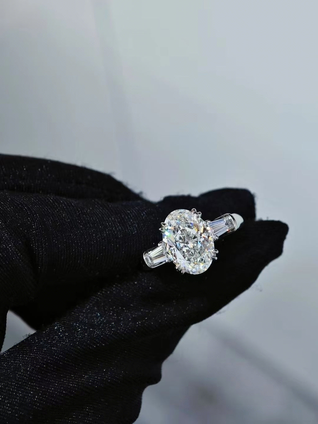 Classic Winston Oval-Shaped Engagement Ring with Tapered Baguette Side Stones