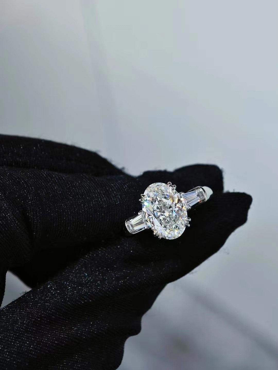 Classic Winston Oval-Shaped Engagement Ring with Tapered Baguette Side Stones