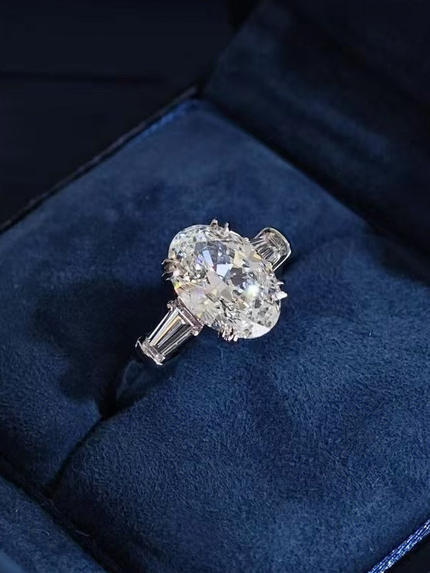 Classic Winston Oval-Shaped Engagement Ring with Tapered Baguette Side Stones
