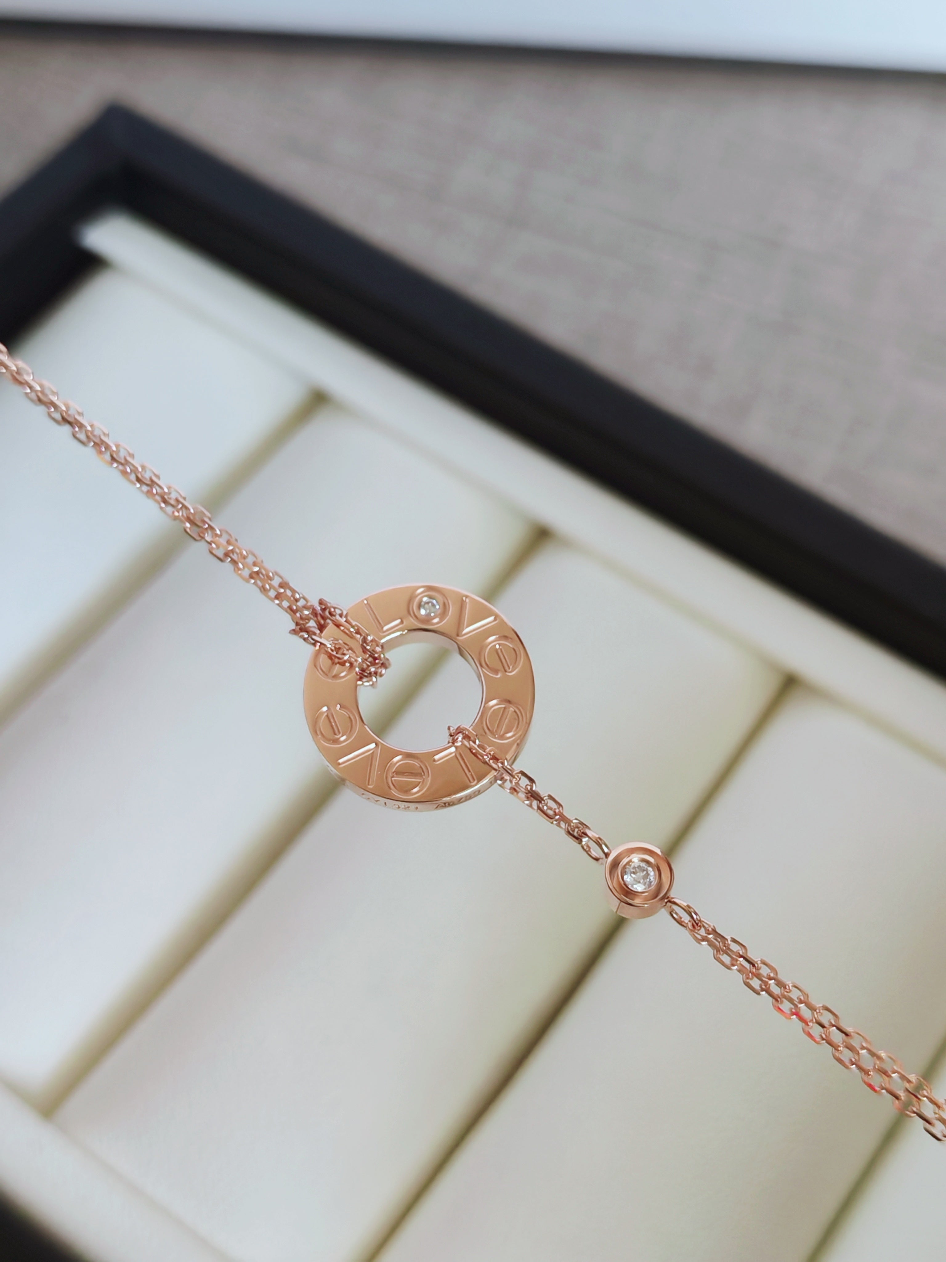 LOVE bracelet, on a chain, 2 pink sapphires
