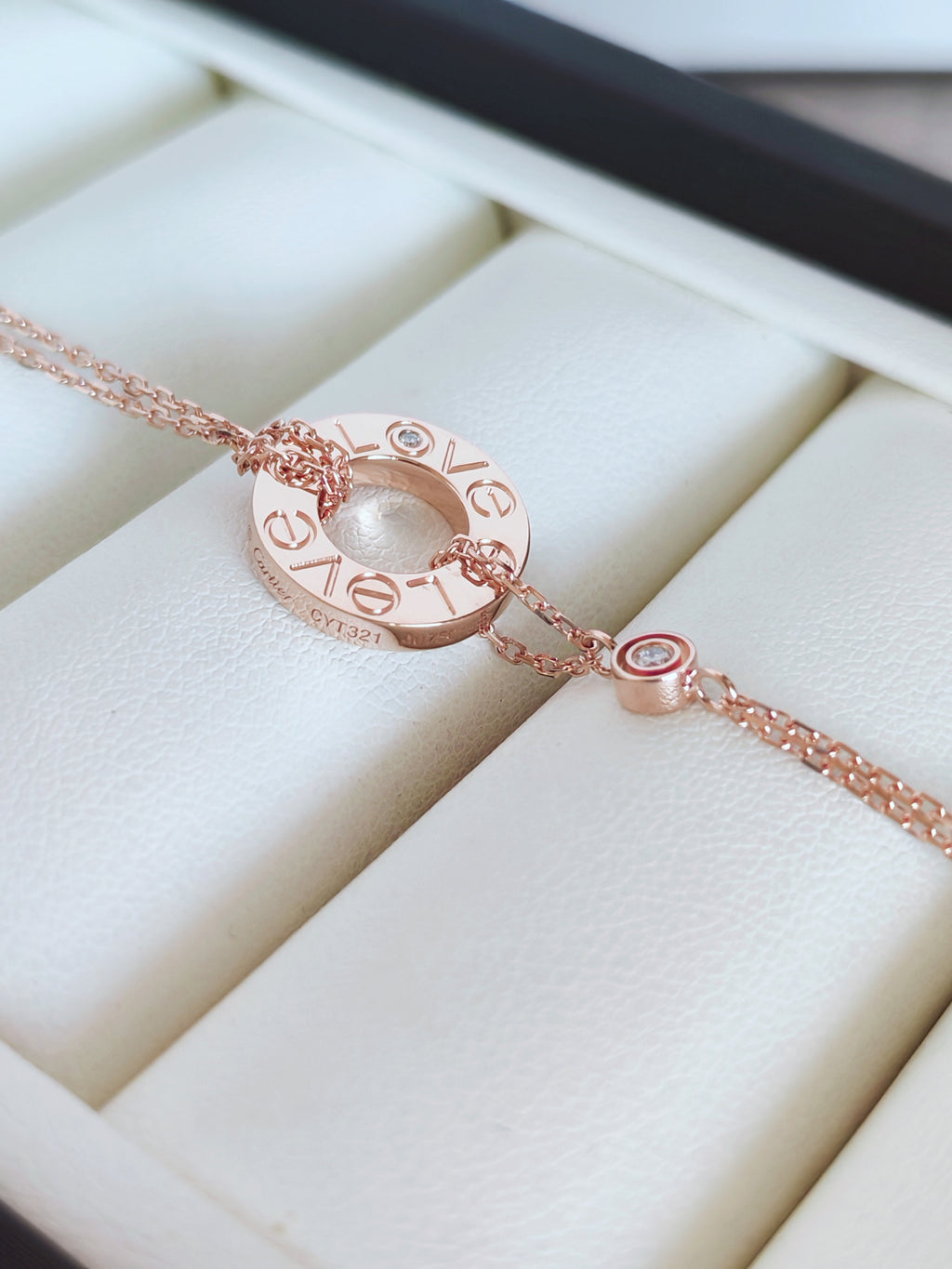 LOVE bracelet, on a chain, 2 pink sapphires